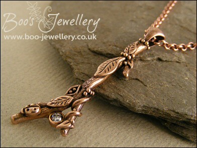 Hand sculpted twig pendant set with cubic zirconium gemstone