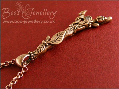 Hand sculpted twig pendant set with cubic zirconium gemstone