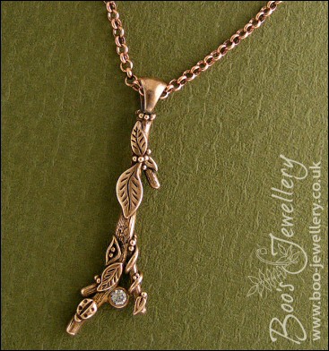 Hand sculpted twig pendant set with cubic zirconium gemstone
