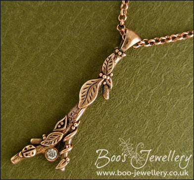 Hand sculpted twig pendant set with cubic zirconium gemstone
