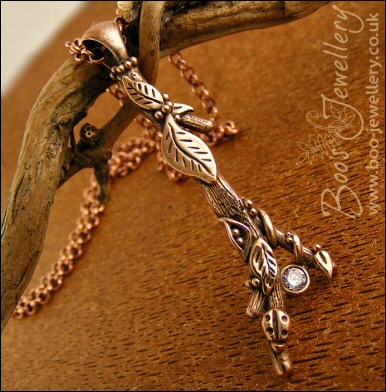 Hand sculpted twig pendant set with cubic zirconium gemstone