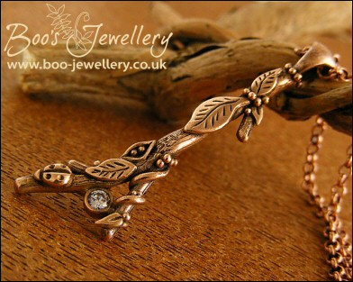 Hand sculpted twig pendant set with cubic zirconium gemstone