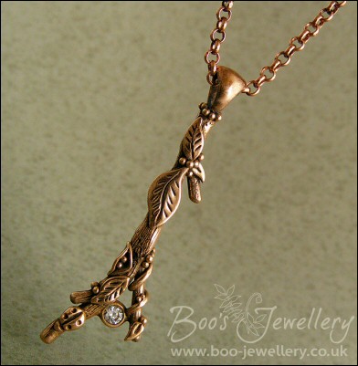Hand sculpted twig pendant set with cubic zirconium gemstone