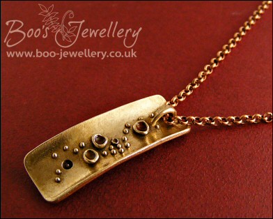 Bronze bark pendant featuring tiny resin filled cup fungi