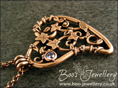 Filigree heart pendant with ivy leaves, berries and a CZ gemstone
