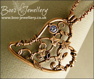 Filigree heart pendant with ivy leaves, berries and a CZ gemstone