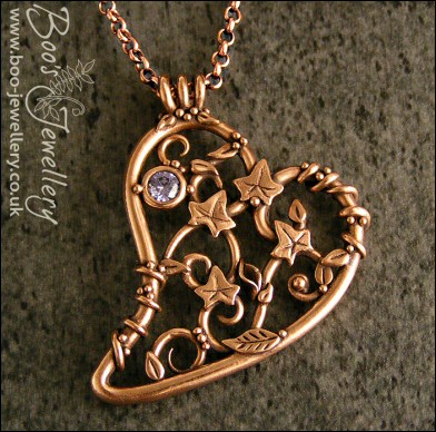 Filigree heart pendant with ivy leaves, berries and a CZ gemstone