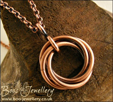 Antiqued copper mobius flower pendant on belcher chain