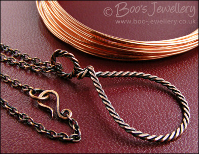 Antiqued copper knotted rope loop pendant on chain