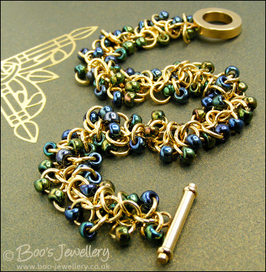 Gold plated Shaggy Loops bracelet in blue greens