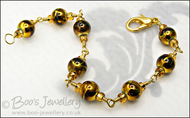 Gold and brown bracelet - glass beads and brass