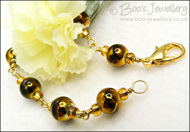 Gold and brown bracelet - glass beads and brass