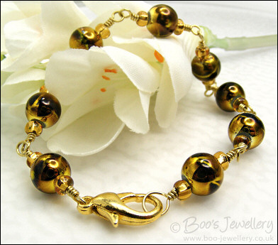 Gold and brown bracelet - glass beads and brass