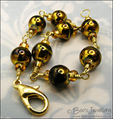 Gold and brown bracelet - glass beads and brass