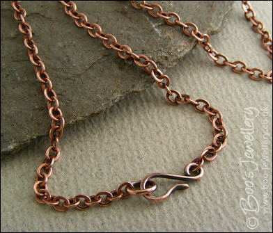 Copper and bronze necklace wrapped with buds and flowers