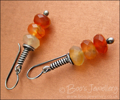 Sterling silver long wrap earrings with faceted Carnelian rondelles