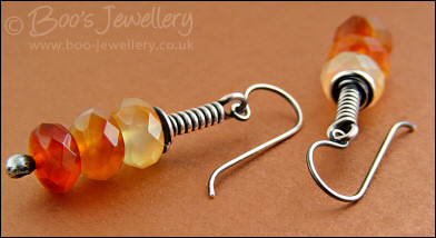 Sterling silver long wrap earrings with faceted Carnelian rondelles