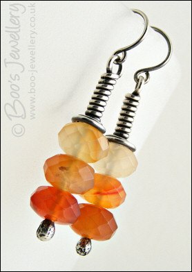 Sterling silver long wrap earrings with faceted Carnelian rondelles