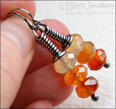 Sterling silver long wrap earrings with faceted Carnelian rondelles