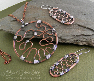 RESERVED - Copper circle pendant with Sterling silver wrapped details