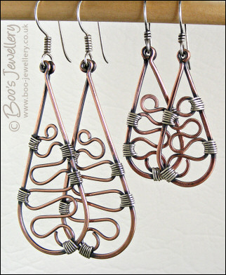 Squiggle filled teardrop earrings in copper and silver