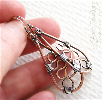 Squiggle filled teardrop earrings in copper and silver