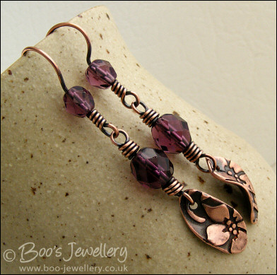 Amethyst coloured crystal and flower charm earrings