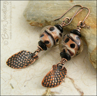 Spotted glass bead and copper charm earrings