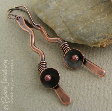Antiqued copper squiggle earrings with a bud and flower