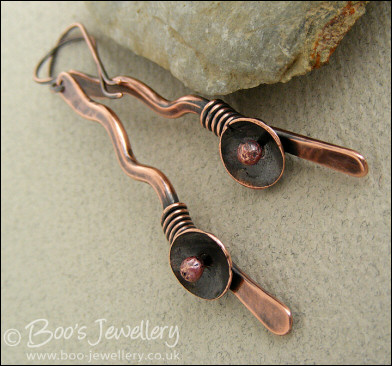 Antiqued copper squiggle earrings with a bud and flower