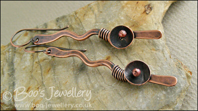 Antiqued copper squiggle earrings with a bud and flower