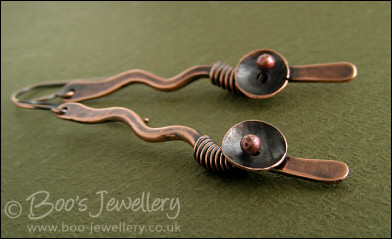 Antiqued copper squiggle earrings with a bud and flower