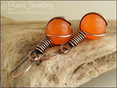 Antiqued copper and orange jade rosebud knot earrings
