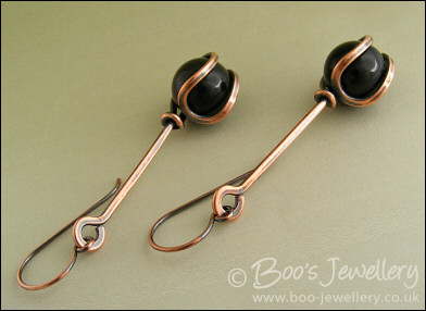 RESERVED - Antiqued copper loop capture earrings