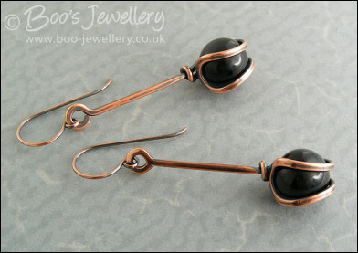 RESERVED - Antiqued copper loop capture earrings