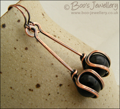 RESERVED - Antiqued copper loop capture earrings