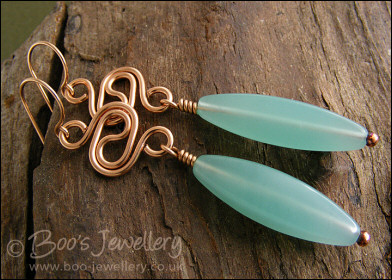 Bronze swirl link earrings with aquamarine coloured torpedo beads