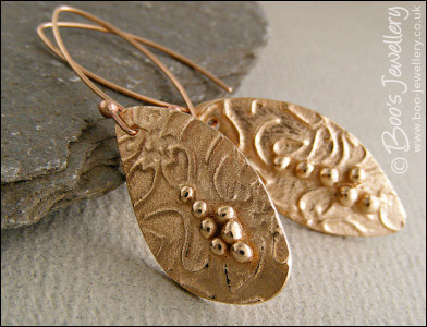 Bronze flower imprint earrings with balled texture