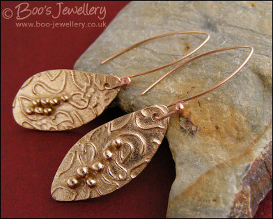 Bronze flower imprint earrings with balled texture