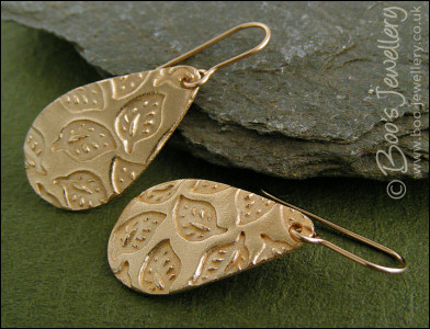 Bronze teardrop earrings with hand drawn leaf imprint