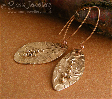 Bronze flower imprint earrings with balled texture