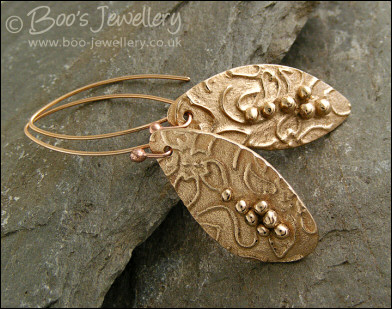 Bronze flower imprint earrings with balled texture
