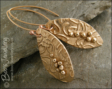 Bronze flower imprint earrings with balled texture