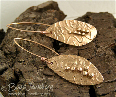 Bronze flower imprint earrings with balled texture