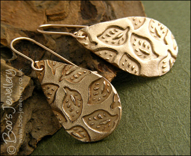 Bronze teardrop earrings with hand drawn leaf imprint