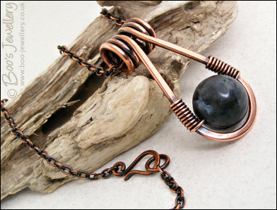 Antiqued copper necklace featuring a teardrop shaped pendant
