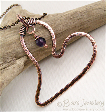 Copper heart pendant with faceted rainbow fluorite stone