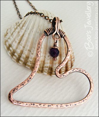Copper heart pendant with faceted rainbow fluorite stone