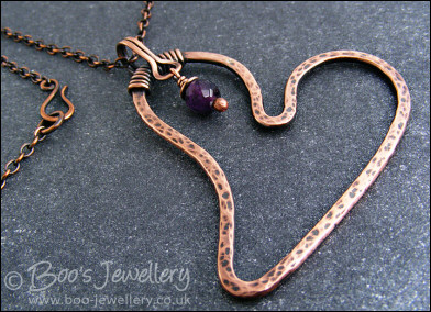 Copper heart pendant with faceted rainbow fluorite stone