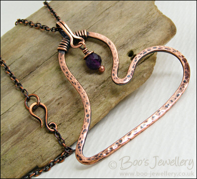 Copper heart pendant with faceted rainbow fluorite stone
